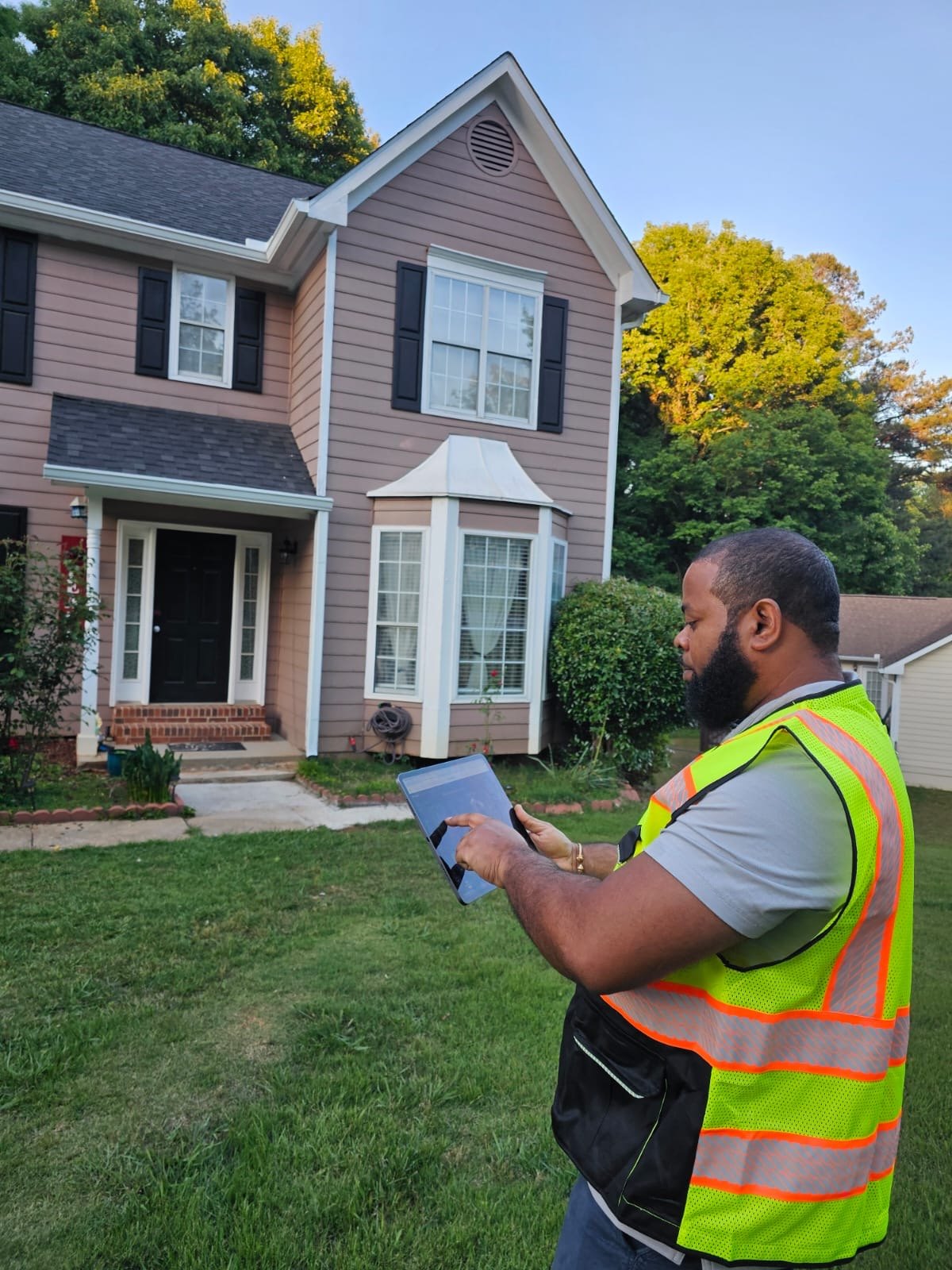 Solar site surveyor using InstallerView on tablet during a residential survey