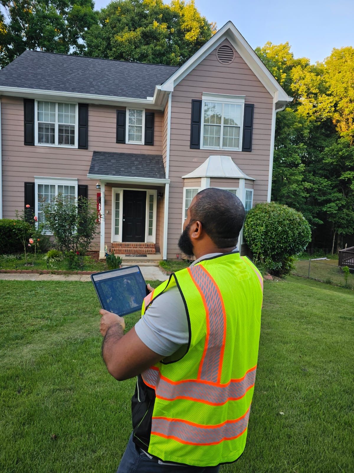 Site surveyor working on residential roof using InstallerView